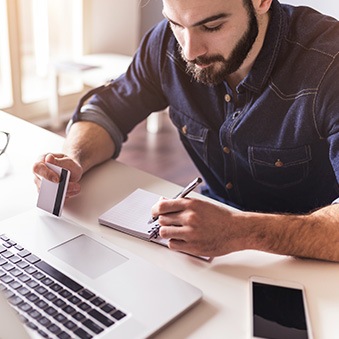 man filling out paperwork