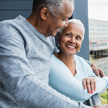 older black couple smiling together