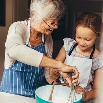 grandmother baking with her granddaughter