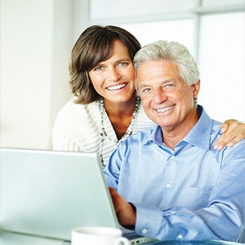 husband and wife with computer