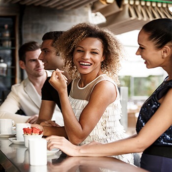 woman having coffee with friends