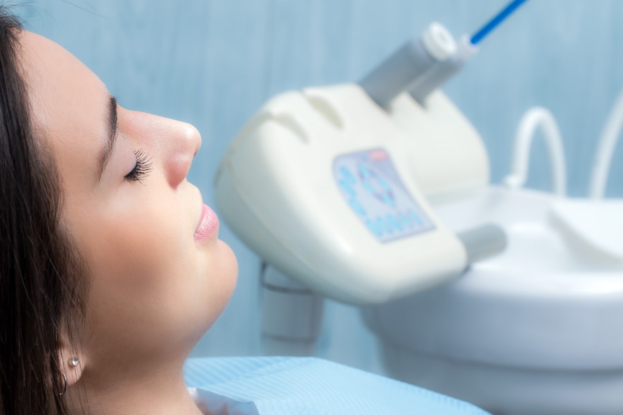 Female patient relaxing in the dental chair.