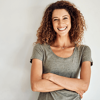 woman smiling with crossed arms