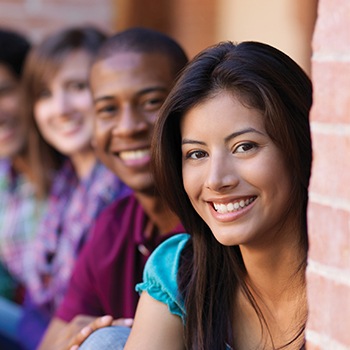 young woman smiling with friends