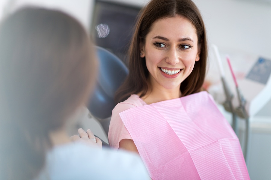 woman sitting in dental chair as a new patient southern dental fort smith